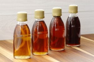 Four bottles in a row. Natural farm products can also be olive oil or other oils. 