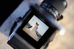 Showing a wedding photo in a camera. Branding a wedding business is hard but rewarding