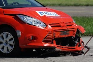 Red damaged sports car. Marketing for the insurance industry does not have to be hard