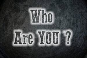 Unique brand personality required you to know Who you are ? This is a black background text with that question