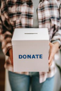 A box with DONATE written on it. Branding for fundraiser