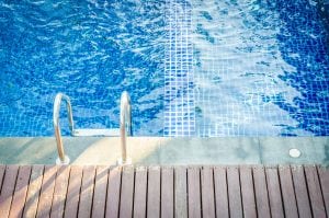 Lovely blue inviting pool is a good image to use when you market your pool business 