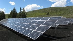 Marketing for charities can create projects to help people with electricity. Photo of Solar panels in a field. 