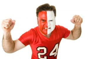 Logos for Sports Fanatics can be colorful. Photo of a man with his face painted in white and red to match his team.