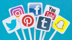 7 of the most important social media signs on colorful sticks symbolising the steps using marketing in social media can be fun an inexpensive