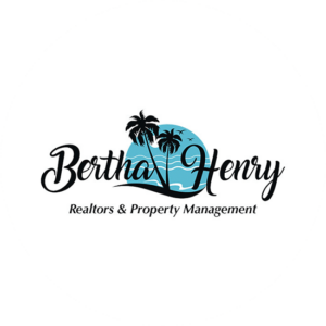 Real estate logo with a tropical palm tree and in different colors.