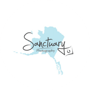 Sanctuary photography logo design is a decorative font and a splash of blue in the background