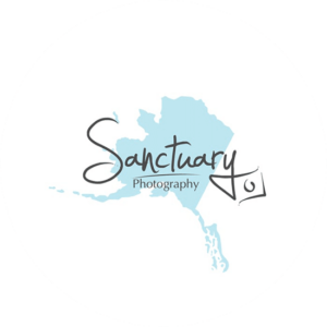Sanctuary photography logo design is a decorative font and a splash of blue in the background