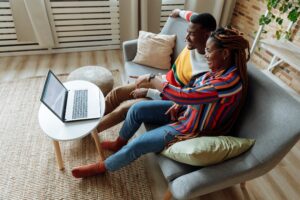 Couple watching television. Email marketing can be like a soap opera, dramatic