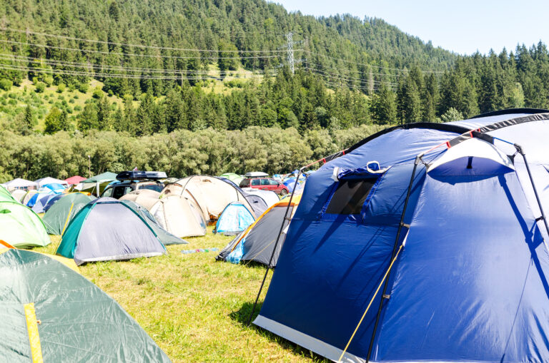 Outdoorsy logo is especially for business concentrating on the outdoors. Here a group of colorful tents.