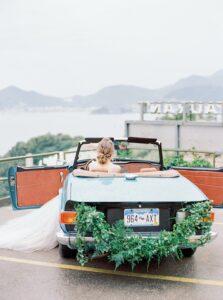 Decorated wedding car with only the bride inside the car. Successful wedding photography business concentrates on what they are good at.