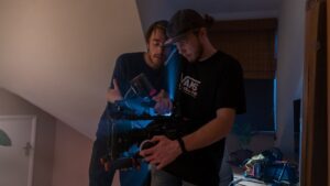 Film directing business is a great start your own business but it takes time, skills and connections. Two men directing a film in the making