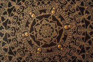Beautiful brown and golden mandala used in spiritual logo design