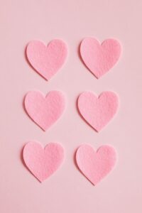 pink hearts on a pink background to symbolize passion for logo design