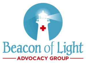 A lighthouse in white with a red cross. The circular logo is the end result of this case study for a medical logo. The company is called Beacon Of Light