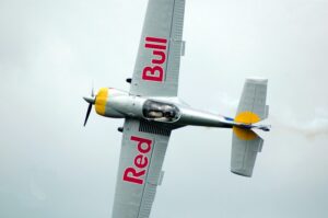 Gray Red Bull Monoplane on Mid Air. Brand activation campain