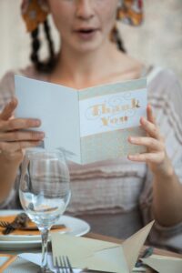 Woman Holding White Friendsgiving Card