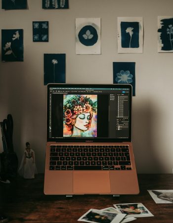 A Laptop Standing on a Desk Displaying an Illustration. How to do digital art is up to you but do test your software.