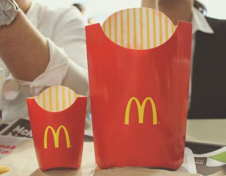 Mac Donalds always swam to find the optimal size for every package. Here a big and a small packet of fries standing next to one another