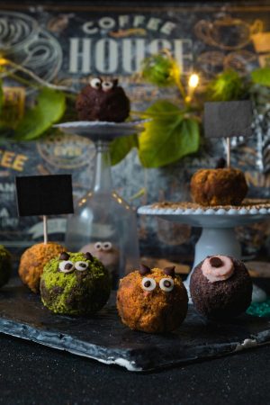 Halloween logo design ideas with Chocolate Balls Muffin on a stand Halloween logo design ideas with Chocolate Balls Muffin on a stand