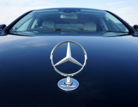 Mercedes-Benz is another luxury logo in the category logos beginning with the letter M. A three pointed star on a black car.