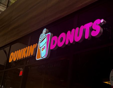 Indoors or outdoor signs for Donuts in orange and pink. High visibility