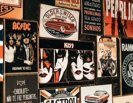 Custom logo comes in all shapes like these examples on a wall. Lots of different company logos and record companies logos