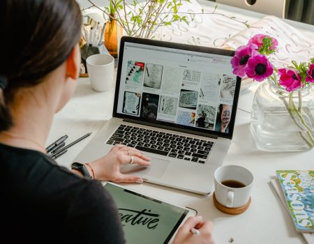 Photo Of Person Using Laptop For Graphic Designs trying to remove white background to a logo