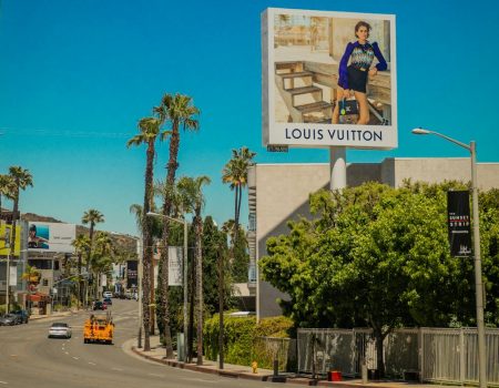 A luxury brand Louis Vuitton Billboard Near the Building