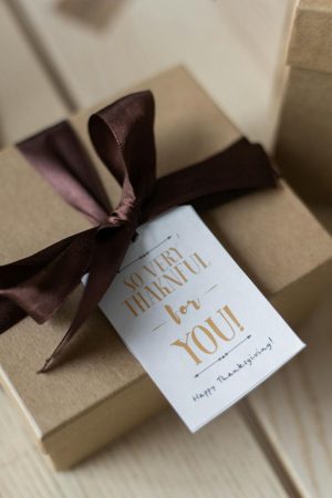 Present in box with a thanksgiving card