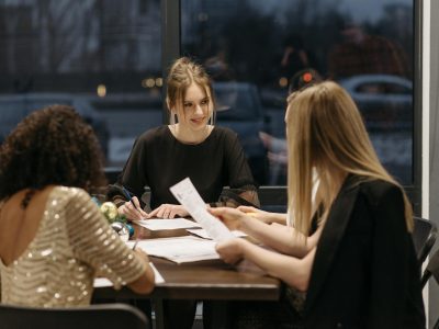 A group of people designing the company's Christmas card with a logo