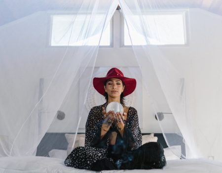 Woman holding a crystal globe.