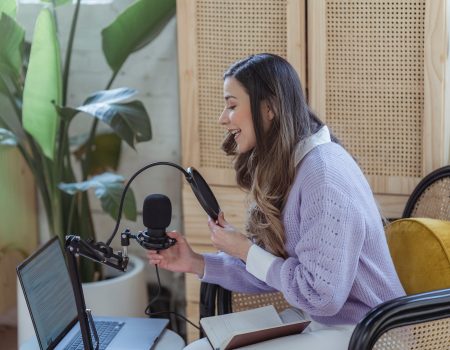 Woman recording audio podcast on equipment. Influencer marketing is powerful