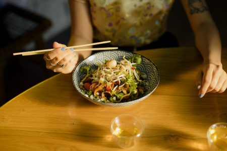 Logos for Chinese restaurants have to be appetising like this meal with noddles and vegetables.