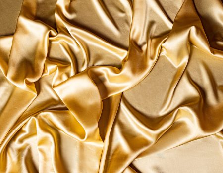 A bedsheet in gold. Gold logos can be spectacular and attract customers if used right