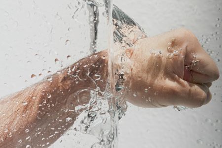 Person’s Left Fist Punching Water Person's Left Fist Punching Water. One way to visualize impact logo design