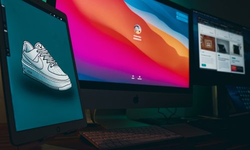 A digital drawing of a running shoe, next to one colorful screen in pink, orange and blue.