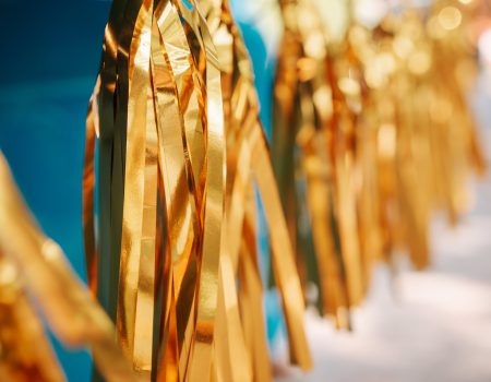 Sparkling golden pom poms are often use as a symbols in cheer logo design